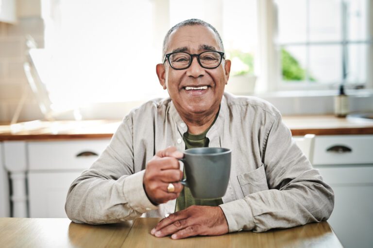 Shot of a senior man sitting alone at home and enjoying a cup of coffee